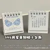 Calendário de Mesa Pequeno Estrela com Asas de Desenho Animado Fofo 2027 Estilo Ins Alto Valor Decoração Mini Ornamento de Mesa para Estudante