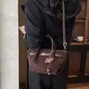 Bolso de mano único para mujer 2026 verano nuevo vintage de alto valor para el trabajo bandolera elegante bolso cubo cruzado