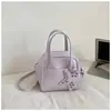 Bolsa de Mão Pequena Estilo Coreano Nicho Bolsa Feminina Novo Design Moderno Bolsa Tote Pequena Versátil para o Dia a Dia Ombro Único Transversal Bolsa Transfronteiriça