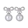 Aretes de Perlas Estilo Corto para Mujer Perla Lazo Incrustado Dulce y Lindo Estilo Coreano Venta Directa de Fábrica Aretes de Aguja de Plata Esterlina S925