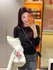 Suéter de punto gris de cuello redondo estilo coreano para mujer, único, hermoso y exquisito, suéter de longitud corta para otoño e invierno, adecuado como top de capa base