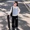 Conjunto casual versátil de moda para niñas estilo coreano, camisa chaleco dopamina otoño 2026, conjunto de capas