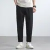 Pantalones cónicos elásticos de seda helada con sensación fresca para hombre, rebajas, novedad verano 2025, tejido gofrado, color liso, adelgazantes, de nueve puntos