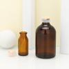 En stock frasco de vidrio farmacéutico marrón de 50 ml viales de 30 ml frasco de vidrio de bayoneta material de embalaje para esencia