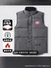 Fábrica Putian Venta al por mayor Chaleco Chaqueta de plumón de ganso Grande Clásico Otoño e Invierno Chaleco Corto Chaleco Chaqueta para Hombres y Mujeres Parejas