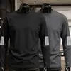 Camiseta casual versátil de manga comprida para outono para homens, gola redonda, cor sólida da moda, confortável, respirável e com caimento solto