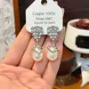 Exquisitos pendientes de perlas en forma de gota de agua ultra brillantes para mujer, diseño de nicho, pendientes de moda y de alta gama, colgantes de oreja únicos y creativos
