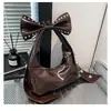 Bolso de Hombro Individual Estilo Dulce y Fresco de Gama Alta para Mujer 2025 Nueva Moda Bolso Personalizado con Remaches Bolso de Celebridad de Internet con Lazo Bajo el Brazo