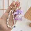 Chaveiro Criativo Sanrio Estrela de Cinco Pontas Boneca Donut Cachorro de Orelhas Grandes Casal Pequena Bolsa de Presente Pingente Atacado
