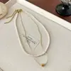 Colar Pequeno de Pérolas em Camadas Duplas em Formato de Coração para Mulheres, Design de Nicho com Toque de Luxo, Luxo Leve, Corrente de Clavícula Versátil e Fashion