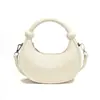 Bolsa de Mão Texturizada em Forma de Meia-Lua para Mulheres 2025 Verão Nova Moda Versátil Bolsa de Axila Simples Casual Estilo Ocidental Bolsa Transversal