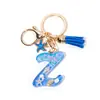 Llavero Colgante Temático Océano Azul con Borla de Estrella de Mar, Llavero de Resina Encanto para Bolso con 26 Letras