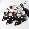 Envío gratis calcetines de invierno de cintura alta desodorantes anti-pilling doble aguja antibacterianos para hombre y mujer mercado mayorista comparable
