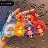 Chaveiro de menina de desenho animado moderno e descolada com cabelo cacheado, pingente de silicone, boneca Nai Fu, acessório para bolsa feminina, pequeno presente chaveiro