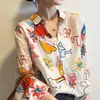 Camisa de Moda Retro Estampada con Cuello para Mujer Primavera/Verano 2026 Nueva Camisa Fina Protectora del Sol para Mujer Moderna