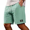 2026 Amazon Nuevos Pantalones Cortos Bermuda Casuales de Color Sólido Ajuste Holgado para Hombre de Algodón y Lino con Cordón Pantalones Cortos de Playa