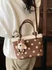 Bolso tipo cubo casual estilo coreano, nuevo bolso de mano otoño e invierno 2026, bolso de hombro y cruzado de moda con lunares único