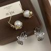 Pendientes de perlas de mariposa 2024 otoño e invierno elegantes pendientes de alta calidad moda personalidad nicho diseño versátil pendientes