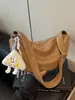 Bolso grande de mujer retro casual 2026 verano nuevo color liso bolsa de albóndiga simple para el trabajo hombro bandolera