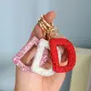 Amazon Llavero Completo de Diamantes 26 Alfabetos Ingleses Diamante de Arcilla Hebilla Redonda Letra Llavero para Llaves de Coche Colgante para Bolso
