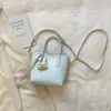 Moda Primavera 2026 Estilo Simples Bolsa de Mão Tipo Balde Estilo Coreano Roupas Casuais para o Trabalho Cor Sólida Bolsa Transversal Feminina