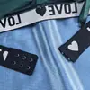 Conjunto Sexy de Lingerie com Renda de Malha Bordada Coração com Letras