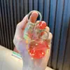 Venta al por mayor de Llaveros para Aliviar el Estrés, Cajas Sorpresa Electrónicas con Líquido, Colgantes para Llaveros y Pequeños Regalos