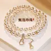 Pulseira com pingente de cabaça de pérola em vidro de camada dupla para mulheres, design de nicho, luxo leve, moderna, valoriza o visual, presente perfeito para namoradas