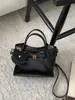 Bolsos de nicho súper populares transfronterizos para mujer 2026 nuevo estilo bolso cruzado tipo cubo bolso pequeño de alta gama exquisito para salir