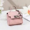 Encanto de Bolso Retro Llavero Billetera Bolsa para Guardar Llaves de Coche Sobre Rojo Funda para Auriculares Colgante Versátil para Bolso