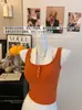 1940 # Estilo chica picante sexy top corto tipo camisola con cuello halter, botones y copas en el pecho, sin mangas