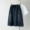 Moda Feminina Plus Size 2026 Verão Novo Estilo Retrô Leve Roupa de Trabalho Saia Casual Jeans Curta 0264