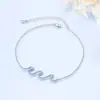 Europa y Estados Unidos más vendidos pulsera de nueva ola para mujer con incrustaciones de diamantes moda todo-partido diseño en forma de ola joyería para la mano suministro transfronterizo