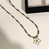 Collar Colgante de Flor con Cuentas de Piedra Ojo de Tigre Melard para Mujer 2026 Nuevo Diseño Nicho Colgante Largo Collar para Suéter