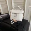 Bolso coreano de diseño nicho 2026 nuevo bolso lonchera con patrón de lichi, bolso cruzado de hombro simple y elegante, bolsa de maquillaje para mujer