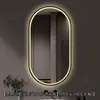 Espejo de baño inteligente ovalado en stock con lijado exterior e iluminación LED translúcida, adecuado para montaje en pared de baño y proyectos hoteleros, con opciones de personalización.