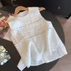 Temperamento de alta clase, cómodo, casual, versátil, agradable para la piel, sin mangas, artístico, top bordado, camisa blanca versátil A12853