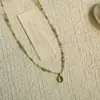Ojo de Gato Escarlata Collar en Capas de Perlas Estilo Retro Francés Cadena de Clavícula de Alta Gama Diseño de Nicho Nuevo Estilo 2026