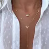 Colar multicamadas estilo europeu e americano transfronteiriço com pérolas artificiais e um pingente de sol dourado, corrente longa com borla para a clavícula, acessório feminino