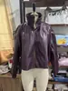 Ropa de mujer transfronteriza, elegante y adecuada para ir al trabajo, color liso, cuello alto, corte holgado, hombros caídos, chaqueta corta de cuero PU para mujer, abrigo casual de otoño e invierno