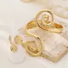 Moda europea y americana personalidad moda espiral Xiangyun pulsera anillo conjunto adecuado para ropa de fiesta de mujer