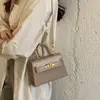 Elegante bolso de mano pequeño retro para mujer, nuevo modelo 2026, bolso cruzado exquisito y versátil, bolso tote pequeño moderno y súper popular
