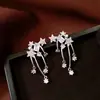 Pendientes de borla con flor de trébol de circonita vintage con un toque de alta gama, pendientes versátiles y de moda al por mayor