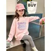 Camiseta de manga comprida para meninas 2026 primavera e outono nova estilosa camiseta básica de primavera infantil para crianças mais velhas, top de algodão puro com desenho