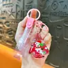 Llavero creativo de árbol de Navidad con aceite, lindo colgante de arena movediza líquida, colgante de Papá Noel y renos, venta al por mayor de regalos