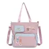 Bolsa de ombro para estudante do ensino fundamental, unissex, casual, grande capacidade, adequada para a escola e aulas de reforço, bolsa transversal, bolsa tote de lona versátil