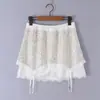 Conjunto de camisola corta ajustada sexy con retazos de encaje y decoración de lazo + falda con retazos de lentejuelas para mujer