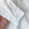 2026 Nova Coleção de Outono Roupas Infantis: Camisa Manga Longa Branca Pura Solta Versátil Estilo Japonês Gola Alta Infantil Nantong Venda por Atacado
