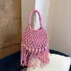 Bolsa de Mão Elegante e Versátil Transfronteiriça para Mulheres 2026 Nova Verão Casual Férias na Praia Bolsa Saco Vazada