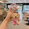 Muñeca Creativa de Pie Caniche Linda Divertida Llavero de Muñeca Vestido de Felpa Perro Pequeño Colgante de Bolso Mujer